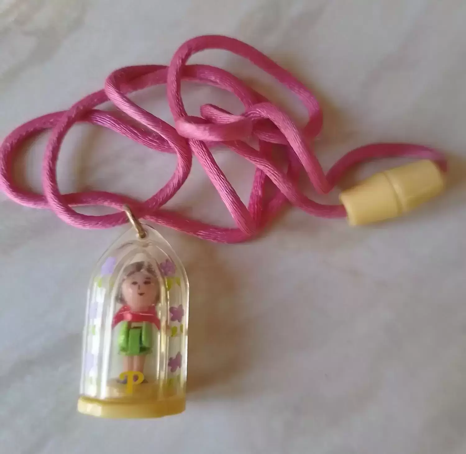Polly Pocket (1989 - 1998) - Pixie in her necklace Yellow Base & Pink Cord
